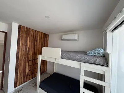 Cama o camas de una habitación en Casa a Pie de Playa