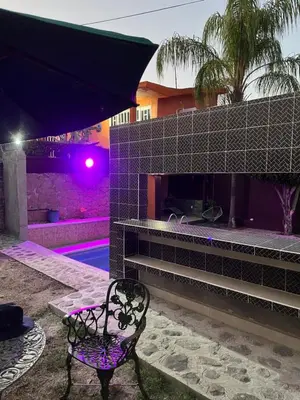 Piscina en o cerca de Bonita casa con alberca en Mazatepec, Morelos