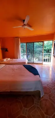 Cama o camas de una habitación en hotel quinta san antonio