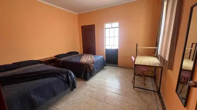Cama o camas de una habitación en Puebla centro casa Peerza
