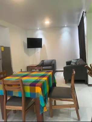 Una televisión o centro de entretenimiento en Departamento WOLF