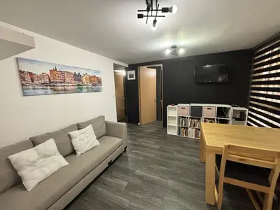Una televisión o centro de entretenimiento en Departamento a 5 minutos del Estadio GNP