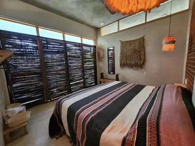Cama o camas de una habitación en Amixtli