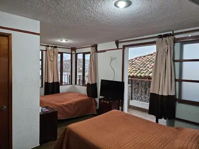Cama o camas de una habitación en Posada Brisas Cuetzalan