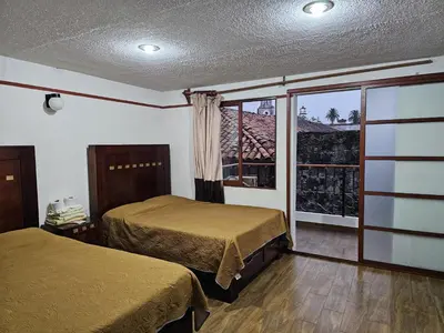 Cama o camas de una habitación en Posada Brisas Cuetzalan