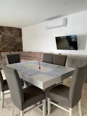 Una televisión o centro de entretenimiento en CASCATTA Residencial Diamante