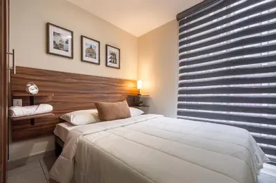 Cama o camas de una habitación en Apto a Pasos del GNP y Aeropuerto