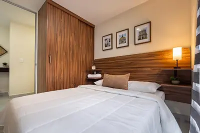Cama o camas de una habitación en Apto a Pasos del GNP y Aeropuerto