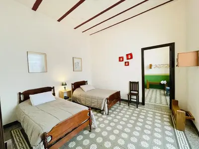 Cama o camas de una habitación en Departamento en casona del siglo XVI frente al Zócalo de Puebla #8