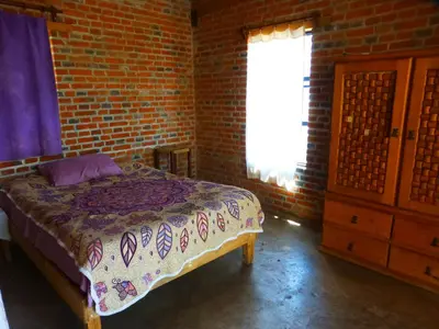 Cama o camas de una habitación en Cabaña en la Montaña Tepozteca
