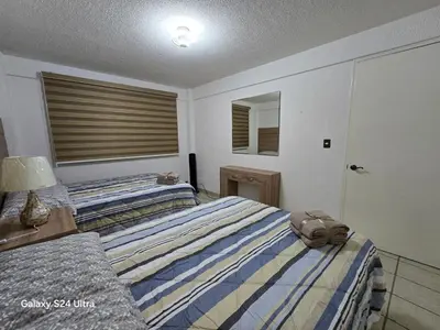 Cama o camas de una habitación en Amplio apartamento sobre Avenida Viaducto