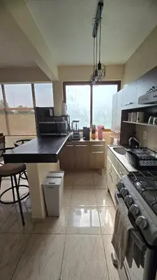 Una cocina o zona de cocina en Departamento acogedor