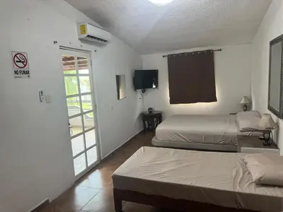 Cama o camas de una habitación en Un rincón cerca del sol