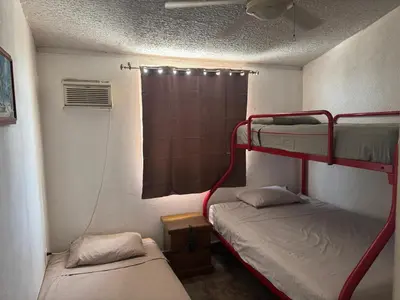 Cama o camas de una habitación en Un rincón cerca del sol