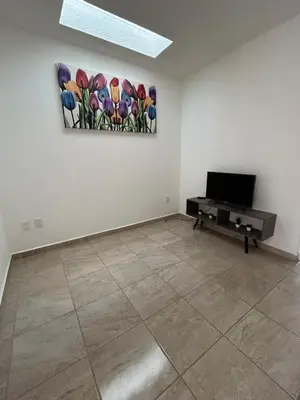 Una televisión o centro de entretenimiento en Casa con Alberca en condominio