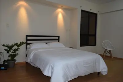 Cama o camas de una habitación en Octava de Orquídeas - Casa completa con estacionamiento y terraza