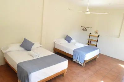 Cama o camas de una habitación en Casa Macuil Punta Zicatela