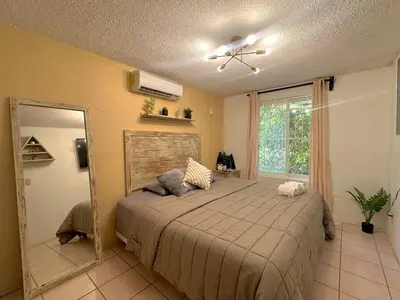 Cama o camas de una habitación en Departamento Céntrico en Huatulco climatizado
