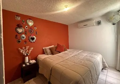 Cama o camas de una habitación en Departamento Céntrico en Huatulco climatizado