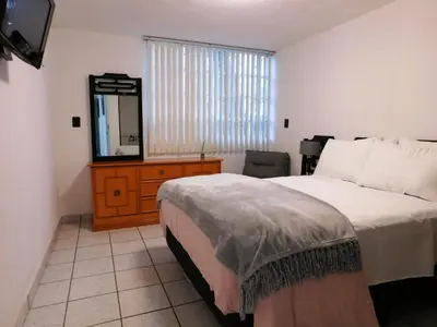 Cama o camas de una habitación en Hospedaje GNP & Autódromo