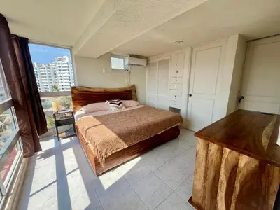 Cama o camas de una habitación en Hermoso departamento en condominio de Costa Azul