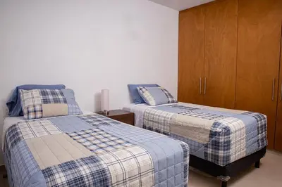 Cama o camas de una habitación en Padrísimo apartamento frente al mar