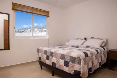 Cama o camas de una habitación en Padrísimo apartamento frente al mar