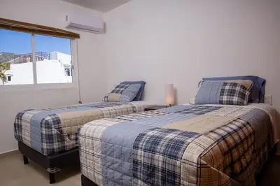 Cama o camas de una habitación en Padrísimo apartamento frente al mar