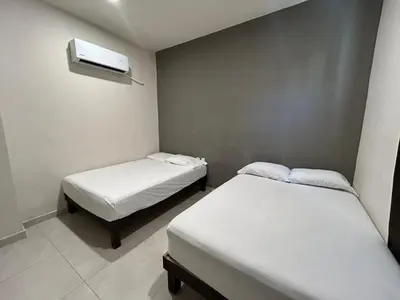 Cama o camas de una habitación en Departamentos frente a Chedraui