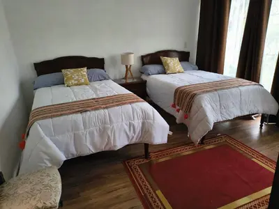 Cama o camas de una habitación en Casa Marcy, casa nueva con alberca y tres recamaras