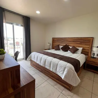 Cama o camas de una habitación en Quinta Candela Hotel