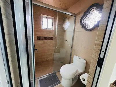 Un baño de Quinta Candela Hotel