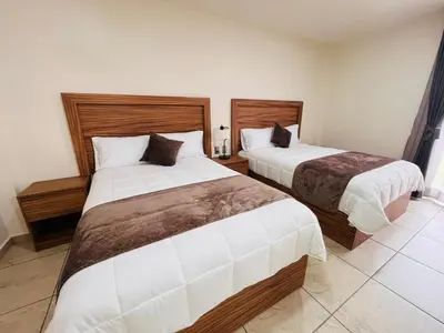 Cama o camas de una habitación en Quinta Candela Hotel