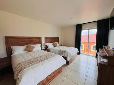 Cama o camas de una habitación en Quinta Candela Hotel