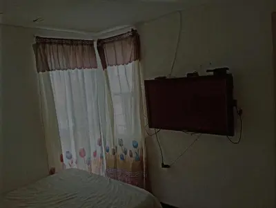 Una televisión o centro de entretenimiento en Like at home