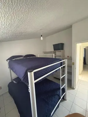 Cama o camas de una habitación en Casa en Acapulco diamante