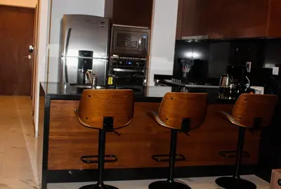 Una cocina o zona de cocina en Hermoso Loft en Pedregal a 500 metros de artz pedregal