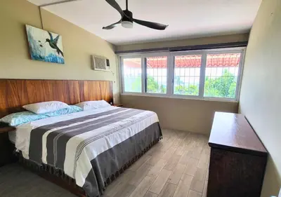 Cama o camas de una habitación en Casa Cactus - Amplia Casa de 2-Habitaciones con Jardín y Alberca
