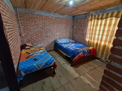 Cama o camas de una habitación en Cabañas Rancho Guadalupe