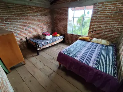 Cama o camas de una habitación en Cabañas Rancho Guadalupe