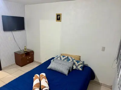 Cama o camas de una habitación en Casa amarilla los volcanes