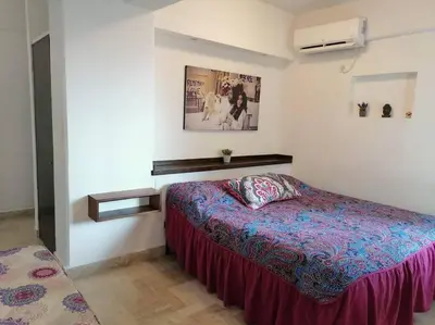 Cama o camas de una habitación en FRENTE AL MAR, centrico