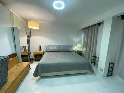 Cama o camas de una habitación en Charming apartment near Los Dinamos and Six Flags
