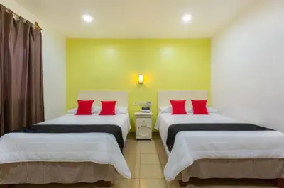Cama o camas de una habitación en Oaxaca Guest Hotel