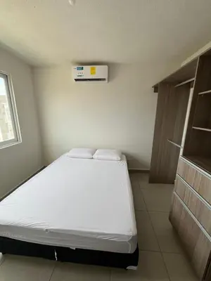 Cama o camas de una habitación en Lyra Vacacional Acapulco