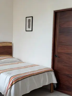 Cama o camas de una habitación en Comfortable Apt near the Beach