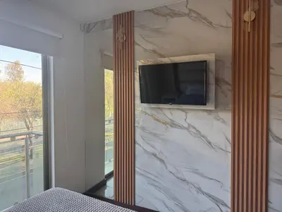 Una televisión o centro de entretenimiento en Departamento muy moderno cerca de foro Sol