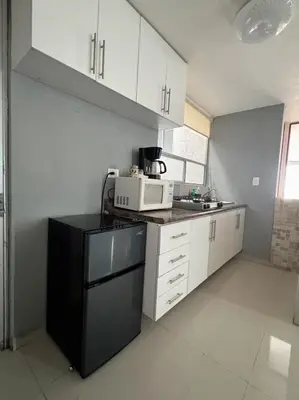 Una cocina o zona de cocina en Cómodo departamento