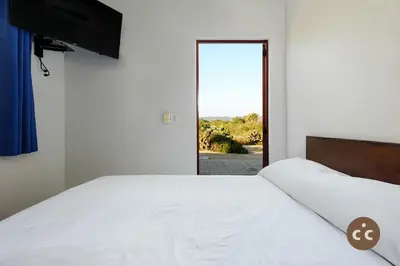 Cama o camas de una habitación en Casa del Angel Tomatal, a beachfront house