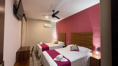 Cama o camas de una habitación en Aeropuerto Express Huatulco